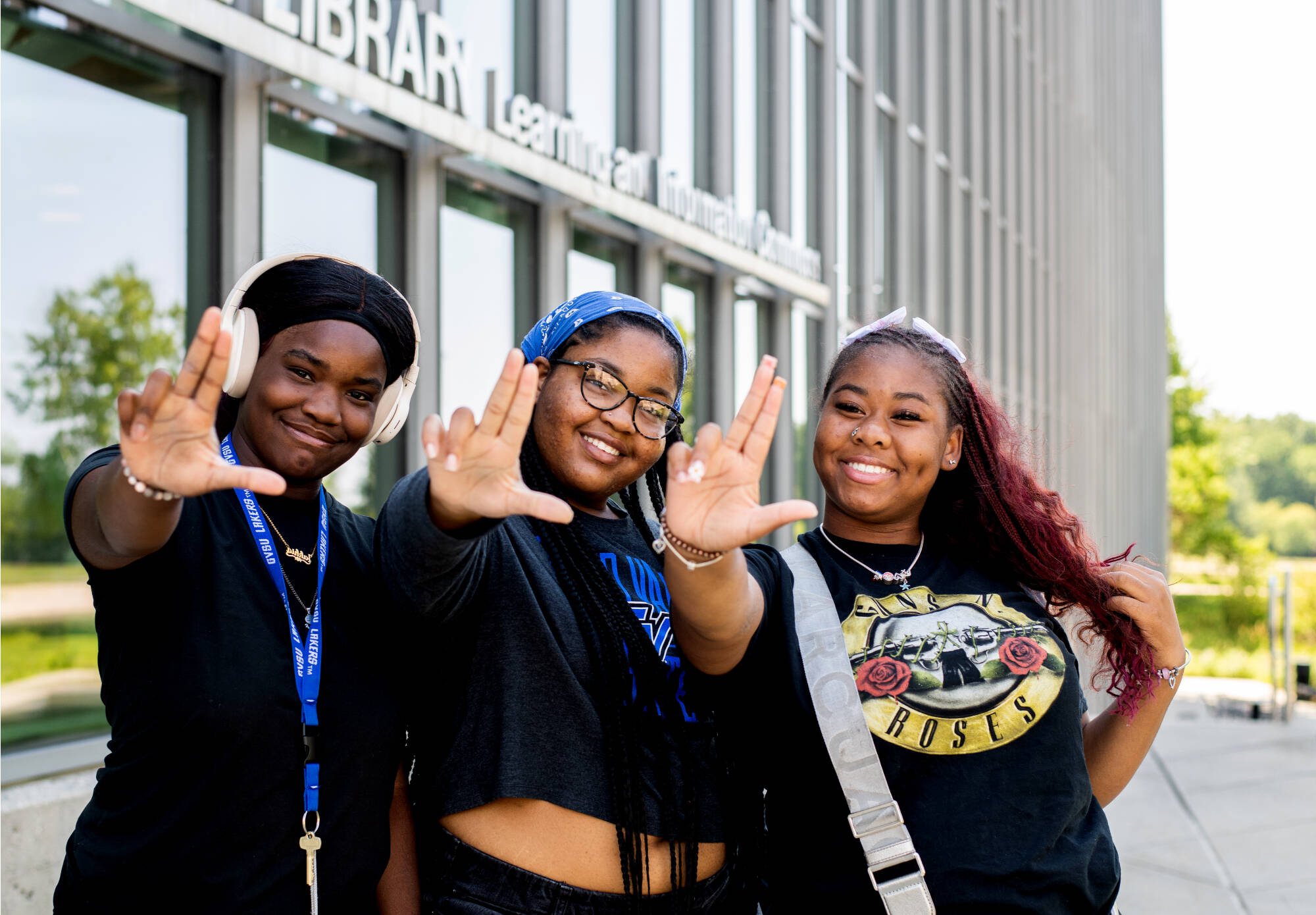 First-year students, from left, communications major Jakhia Johnson, fine arts major Ka’Maria Nathan, and art education major J’Nya Brown pose for a photo as they left their Navigating College Success class held at the Mary Idema Pew Library July 2...